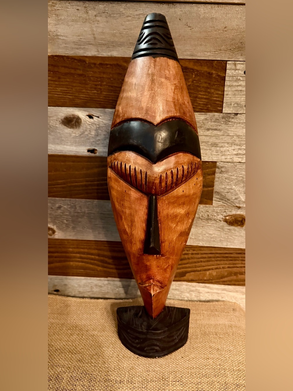 Hand-Carved Wooden Tribal Mask Sculpture in Warm Brown and Black